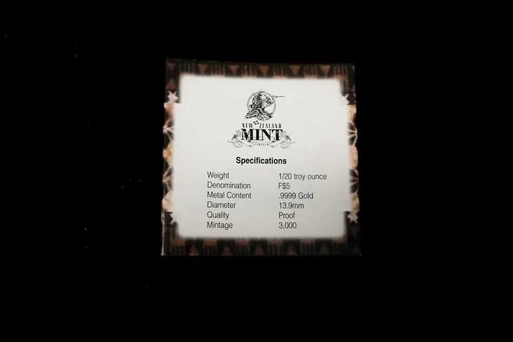 A small square card with a white center and dark brown distressed border, featuring the 'New York Mint' logo and specifications text, shown against a black background.