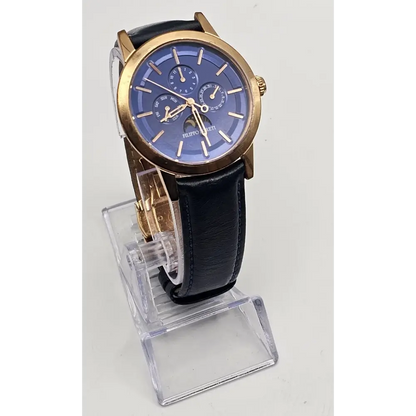 Wristwatch with blue face and gold accents
