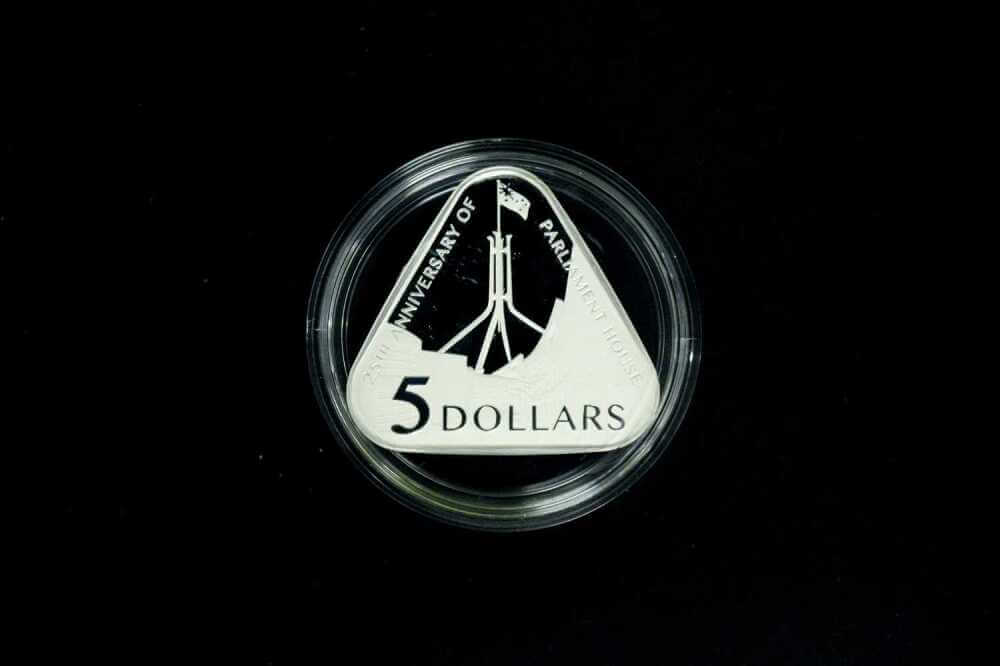 25th Anniversary of Parliament House $5 fine silver proof triangular coin front view
