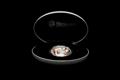 A Perth Mint coin displayed inside an open oval presentation box on a black background. The silver-toned coin is centered in the lower half of the open lid, and the inside lid is printed with the Perth Mint logo and text.