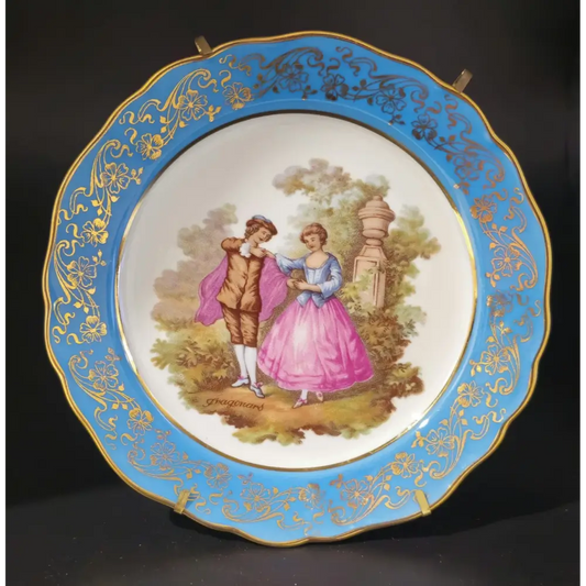 Decorative plate with a couple in a garden scene