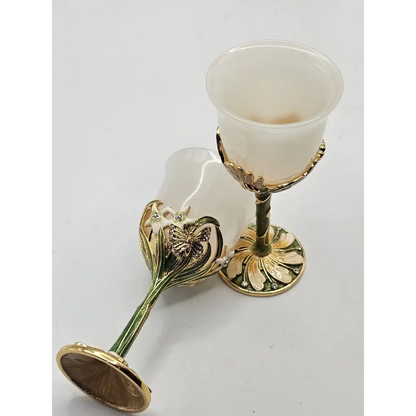 Decorative gold and white goblet on a light gray background