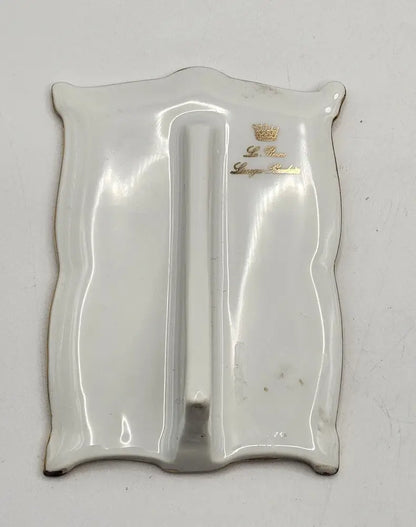 Silver tray with a logo