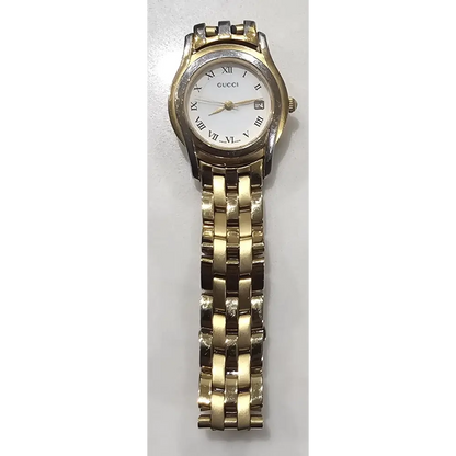 Gold and silver watch on a white background