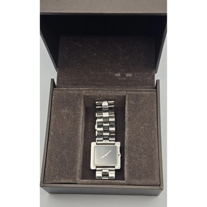 Silver watch in an open box on a white background