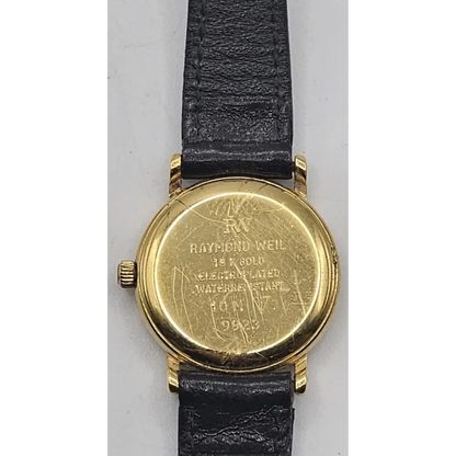 Gold watch with black leather strap