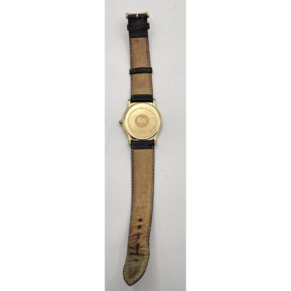 Wristwatch with gold case and brown leather strap