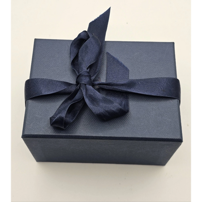 Navy blue gift box with a navy ribbon