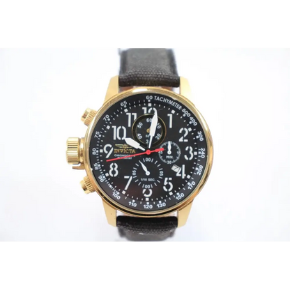 Gold watch with black face 