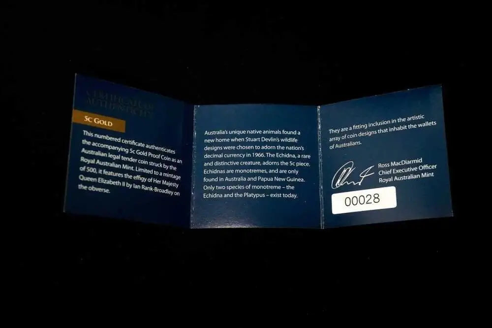 A folded blue certificate insert for an Australian gold coin, displayed against a black background. The left panel is labeled 'AUSTRALIAN GOLD COIN AUTHENTICATION' and shows gold coin details.