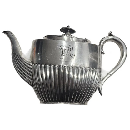 Silver teapot with ribbed design