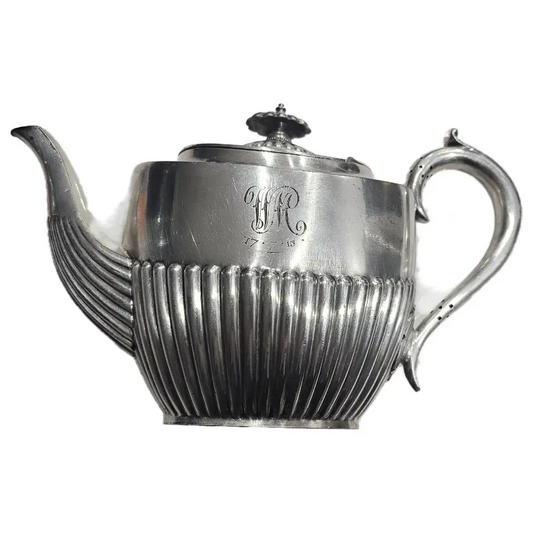 Silver teapot with ribbed design
