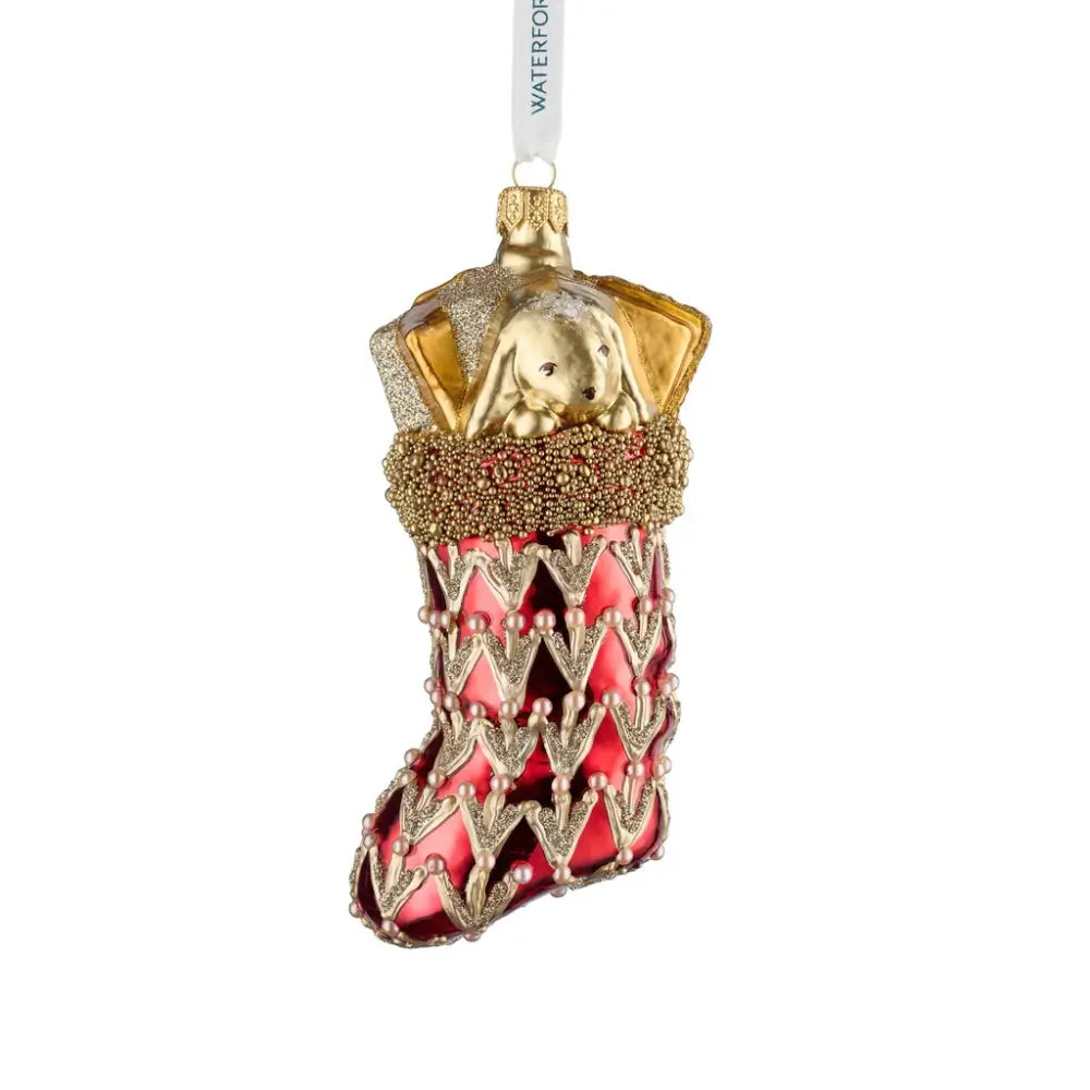 Decorative Christmas ornament with red and gold design on a white background
