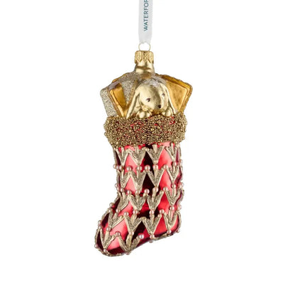 Decorative Christmas ornament with red and gold design on a white background