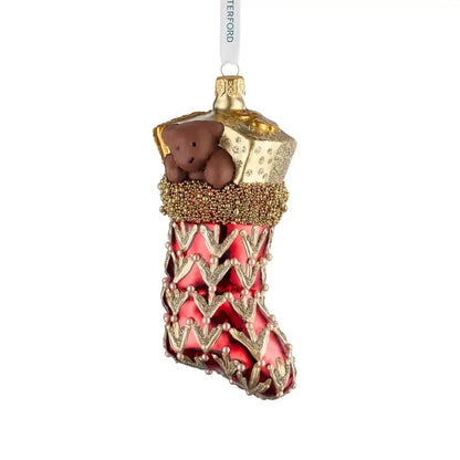 Decorative Christmas stocking ornament with a teddy bear and gold accents on a white background