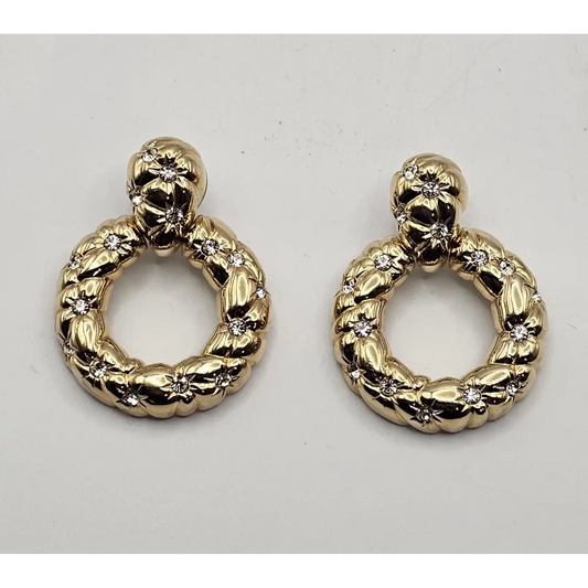 Pair of gold hoop earrings with intricate designs 