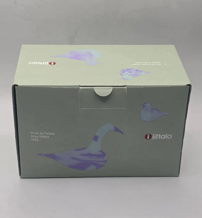 A square product box for the iiftala Birds of Turkey Oiva Tolkko 1972, featuring a muted sage green and lavender illustration of a goose and smaller bird silhouettes.