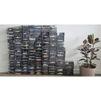 Stack of model car boxes on a shelf