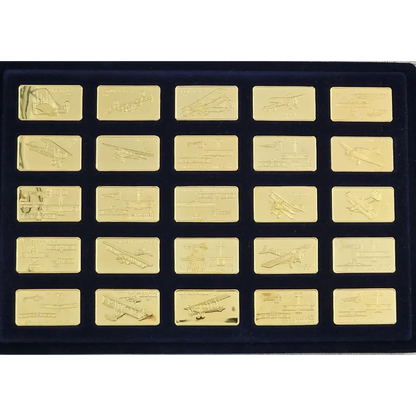 Set of gold bars with engraved designs on a black display case