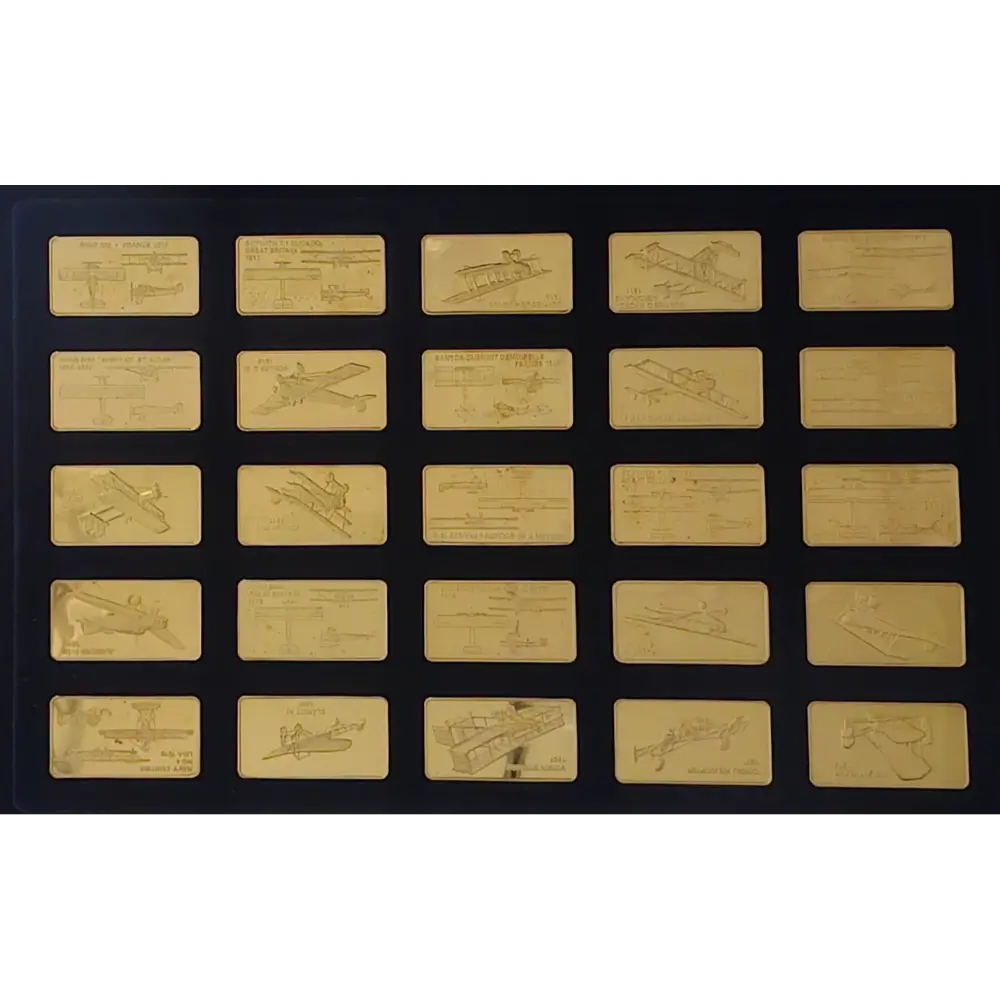 Collection of gold airplane models on a black background