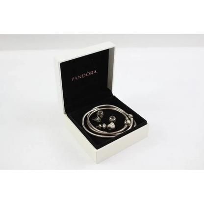 Pandora bracelet with charms in an open Pandora box