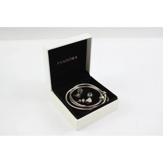 Pandora bracelet with charms in an open Pandora box
