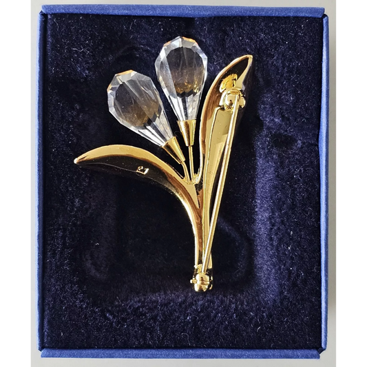 Gold and crystal brooch in a blue box