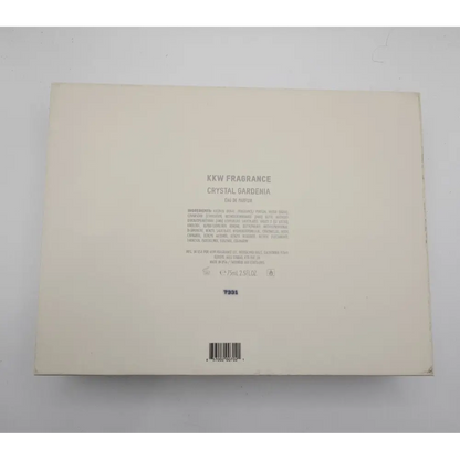 Back of a KKW Fragrance box with text on a gray background