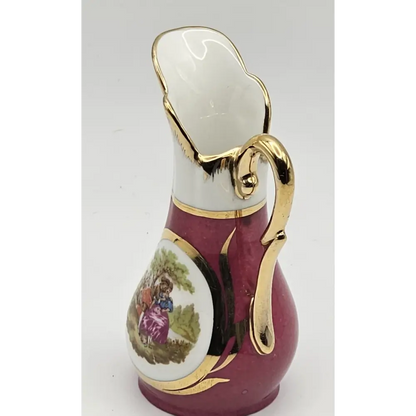 Decorative ceramic pitcher with gold accents