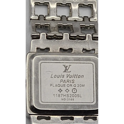 Louis Vuitton metal plaque with brand logo and text 
