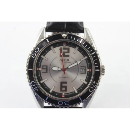 Wristwatch with black strap and silver case on a white background