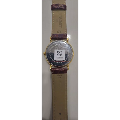 Wristwatch with a brown strap and gold case