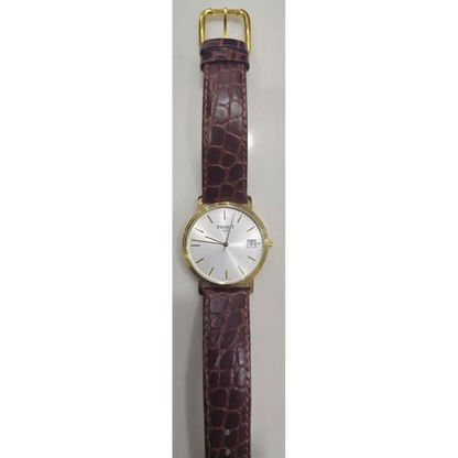 Watch with a brown strap and gold case on a white background