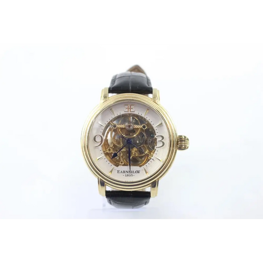 Gold wristwatch with black strap
