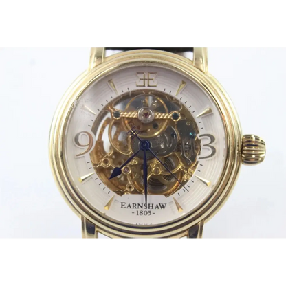 Gold wristwatch with visible mechanical components