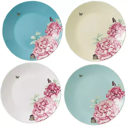 Four ceramic plates with floral designs