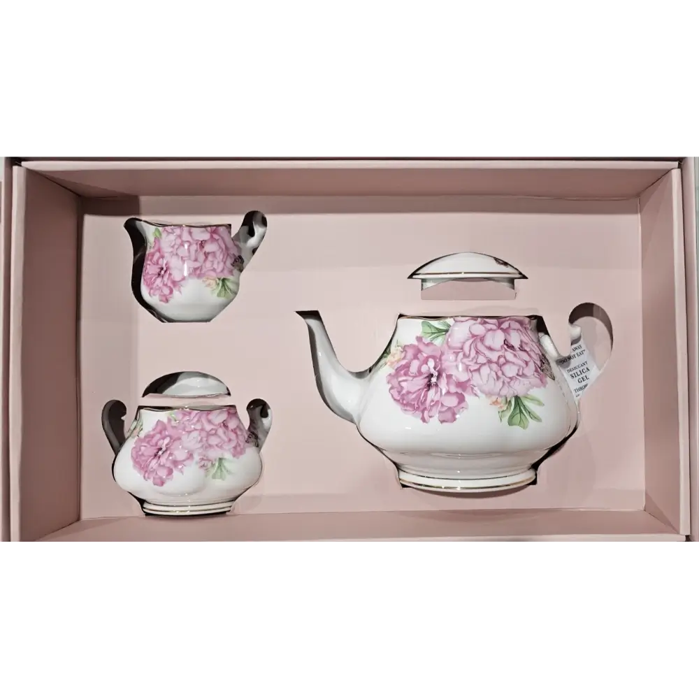 Tea set with pink floral design in a box