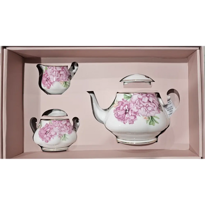 Tea set with pink floral design in a box