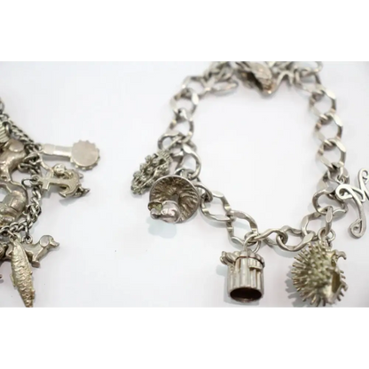 Silver charm bracelets on a white background