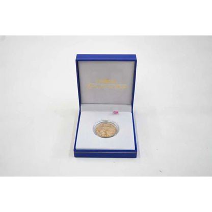 Gold coin in a blue box on a white background