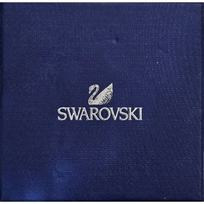 Swarovski logo on a textured blue background