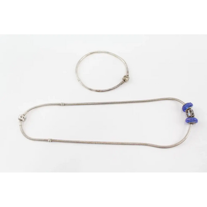 Metallic necklace with a blue clasp
