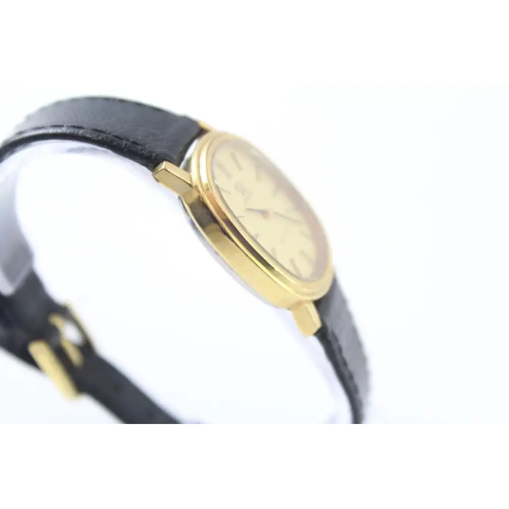 Back case of Omega De Ville hand-wind watch showing serial number