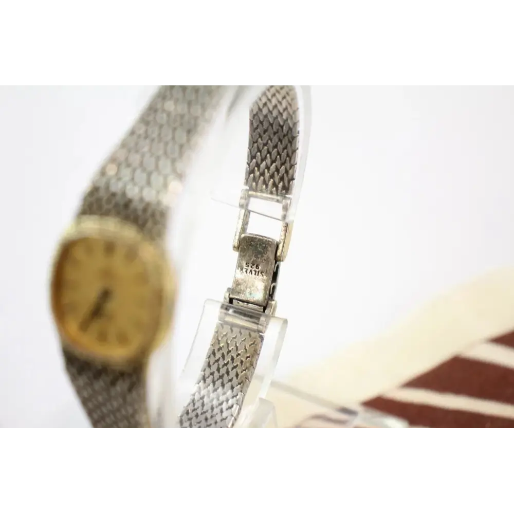 Omega De Ville His & Hers Watches Close-Up Showing Quartz Movement and Silver Accents