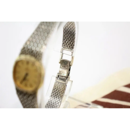 Omega De Ville His & Hers Watches Close-Up Showing Quartz Movement and Silver Accents