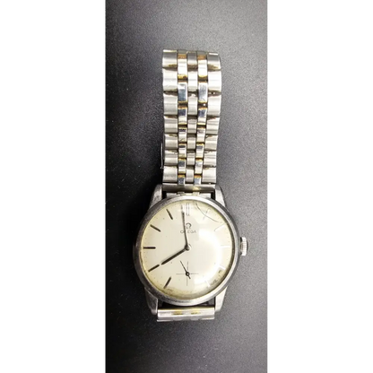 Silver wristwatch with a white face on a dark gray background
