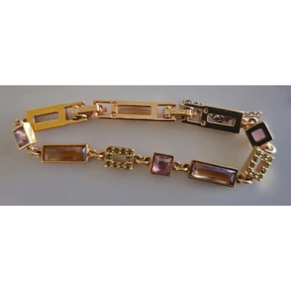 Gold bracelet with gemstone accents