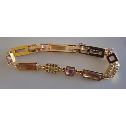 Gold bracelet with gemstone accents