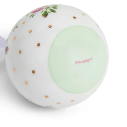 Round ceramic object with floral design and 'Royal Albert' branding