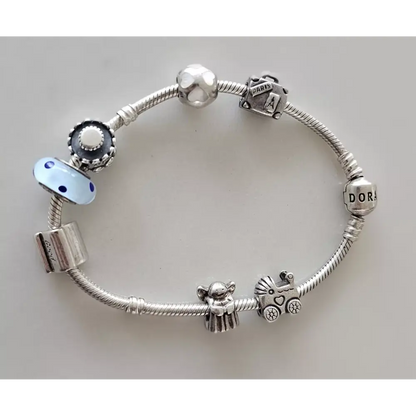 Silver bracelet with various charms 